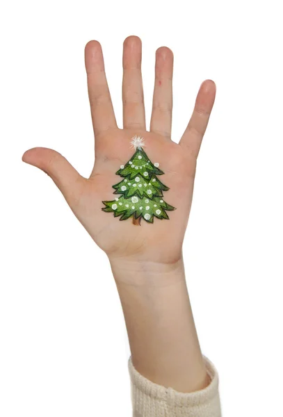 Child's hand with painted Christmas symbol. — Stock Photo, Image