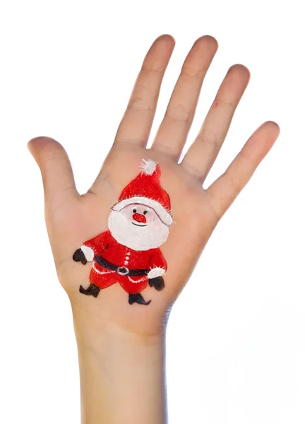 Dziecko za rękę z malowane symbol Bożego Narodzenia. — Zdjęcie stockowe