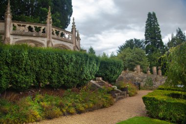 CHIPPENHAM, UK - AUGUST 9, 2014: Castle Combe, unique old English village. Park