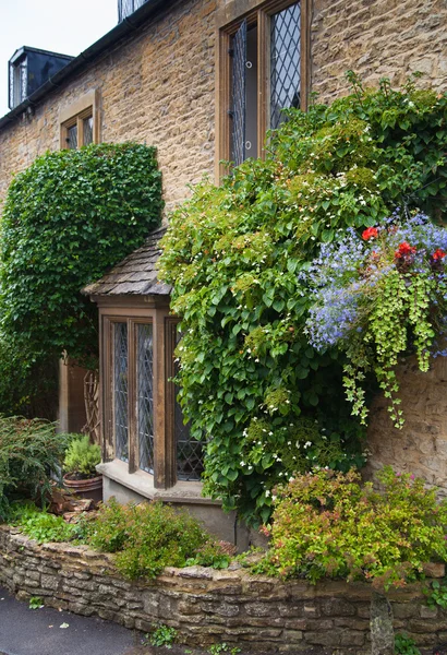 CHIPPENHAM, UK - AUGUST 9, 2014: Castle Combe, unique old English village. — Stock Photo, Image