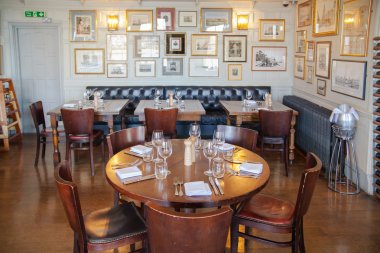 LONDON, UK - APRIL 14, 2015: Old English victorian public house interior. Early morning settings with no people