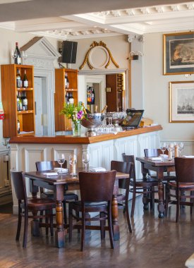 LONDON, UK - APRIL 14, 2015: Old English victorian public house interior. Early morning settings with no people