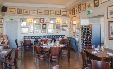 LONDON, UK - APRIL 14, 2015: Old English victorian public house interior. Early morning settings with no people