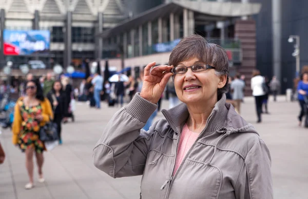 Pension age good looking woman portrait in the City — Stock Photo, Image