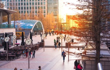 LONDON, UK - MAY 14, 2014: Office people moving fast to get to work at early morning in Canary Wharf aria