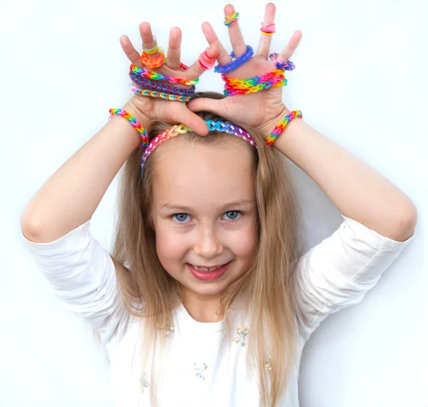 Loom bands craft. Little girl demonstrating her works. — Stock Photo, Image