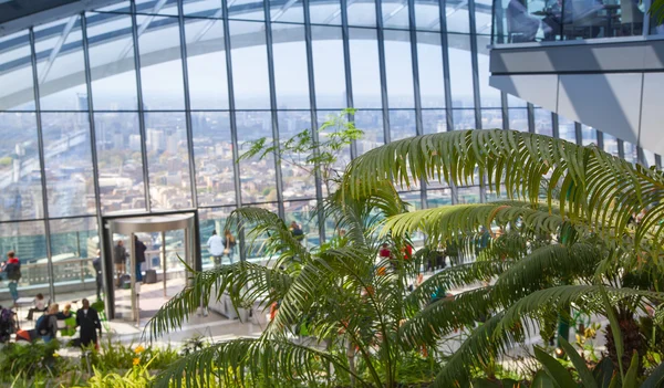 LONDON, UK - APRIL 22, 2015: People in the restaurant of the Sky Garden Walkie-Talkie building. Viewing platform is highest UK garden, locates at the 32 floor and offers amazing skyline of London city — Stock Photo, Image