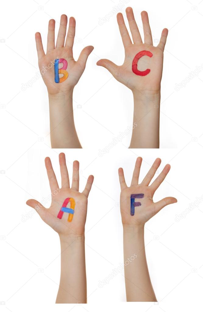 Alphabet (letters) painted on children hands.  Rises up hands.