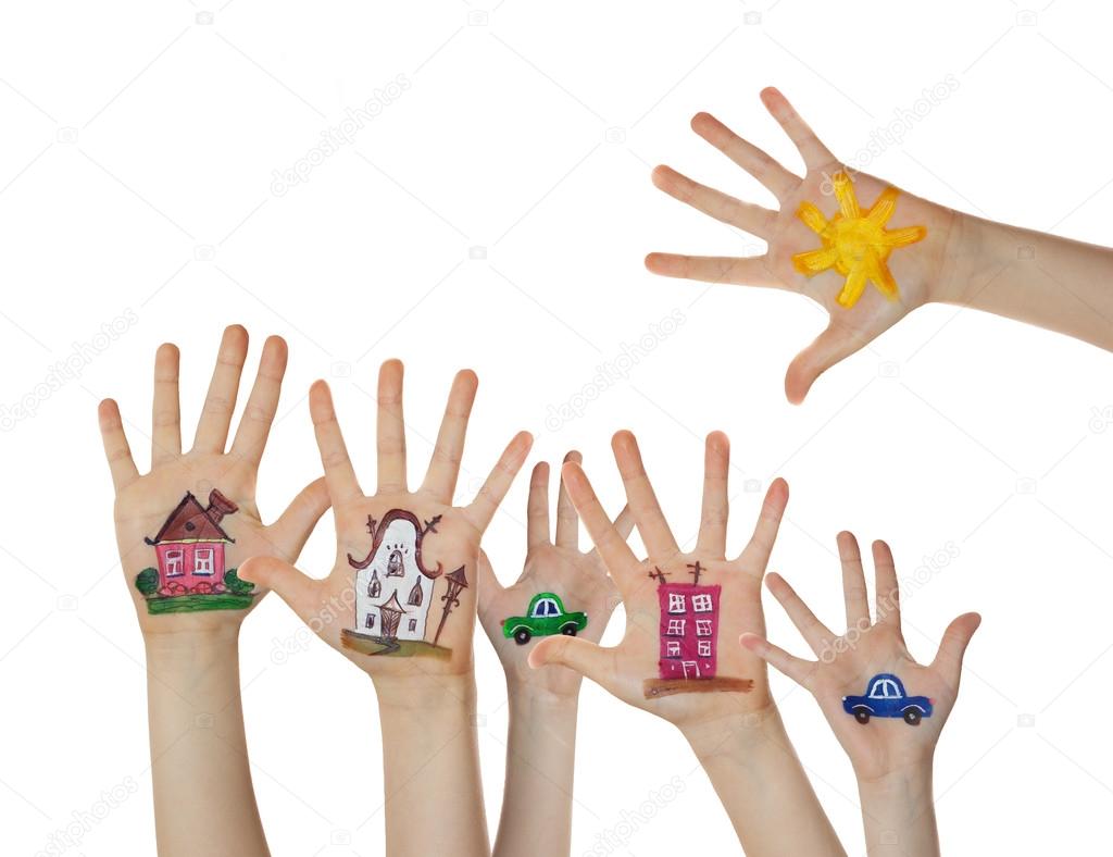 Houses, car and trees painted on children hands. Hands raised up