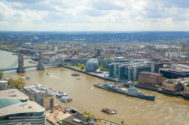 LONDON, UK - APRIL 15, 2015: City of London panorama at sunset. Tower bridge and River Thames