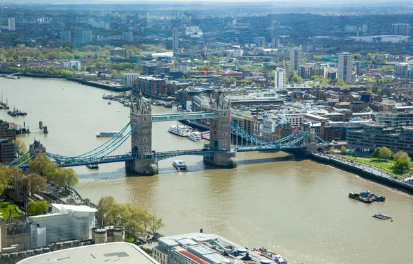 LONDON, UK - APRIL 15, 2015: City of London panorama at sunset. Tower bridge and River Thames