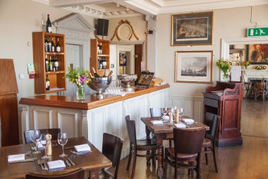 LONDON, UK - APRIL 14, 2015: Old English victorian public house interior. Early morning settings with no people
