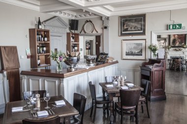 LONDON, UK - APRIL 14, 2015: Old English victorian public house interior. Early morning settings with no people