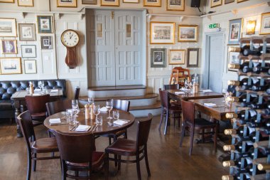 LONDON, UK - APRIL 14, 2015: Old English victorian public house interior. Early morning settings with no people