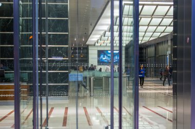 LONDON, UK - 7 SEPTEMBER, 2015: Office building entrance in night light. Canary Wharf night life