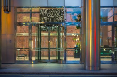LONDON, UK - 7 SEPTEMBER, 2015: Office building entrance in night light. Canary Wharf night life