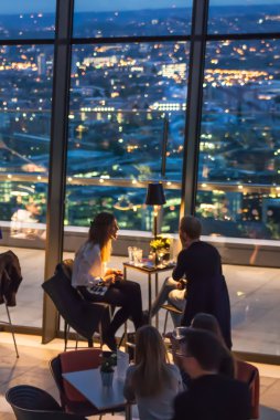 LONDON, UK - MAY 22, 2015: People in restaurant. London's night life