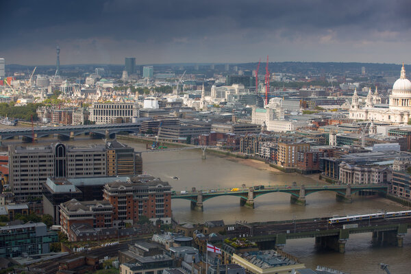 LONDON, UK - SEPTEMBER 17, 2015: London panorama with River Thames, bridges and Canary Wharf banking and business district
