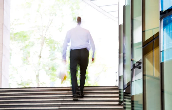 Businessmenwalking up to stairs, blur background. London — Zdjęcie stockowe