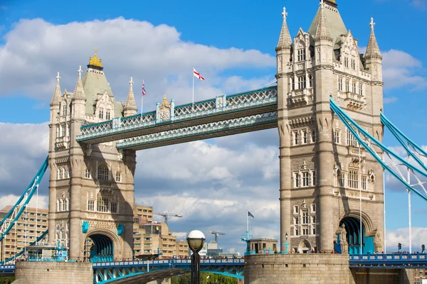 LONDON UK - SEPTEMBER 19, 2015 - Tower Bridge on the River Thames and people walking by embankment — Stok fotoğraf