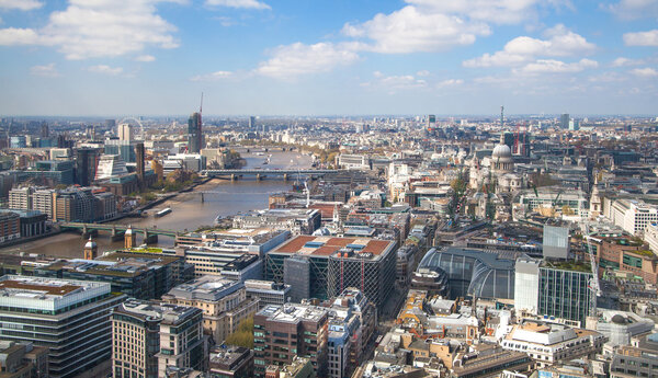 LONDON, UK - SEPTEMBER 17, 2015: City of London aerial view, river Thames and bridges. London panorama form 32 floor of Walkie-Talkie building