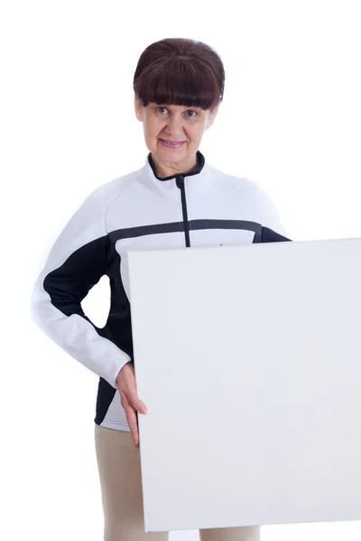 Mature woman leaning on white banner. Portrait against of white background — Stock Photo, Image