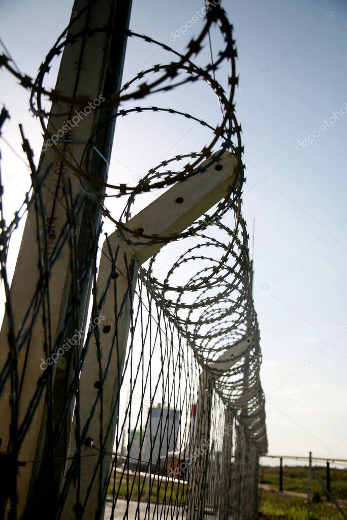 mata de sao joao, bahia / brazil - november 8, 2020: concertina wire fence is seen in an industrial area in the city of Mata de Sao Joao.