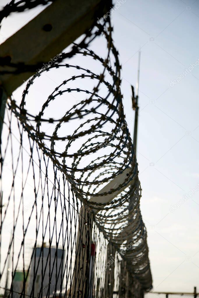mata de sao joao, bahia / brazil - november 8, 2020: concertina wire fence is seen in an industrial area in the city of Mata de Sao Joao.