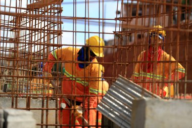 salvador, bahia, barazil - march 23, 2017: Worker handles iron construction work in the city of Salvador. *** Local Caption ***
