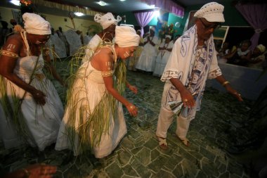 simoes filho, bahia, barazil - february 27, 2016: integrants of the Candomble religion are seen during a religious celebration in a terreiro in the city of Simoes Filho.