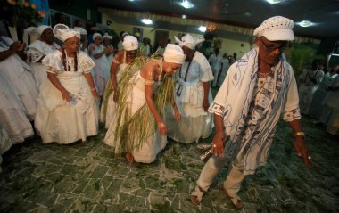 simoes filho, bahia, barazil - february 27, 2016: integrants of the Candomble religion are seen during a religious celebration in a terreiro in the city of Simoes Filho.