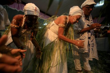 simoes filho, bahia, barazil - february 27, 2016: integrants of the Candomble religion are seen during a religious celebration in a terreiro in the city of Simoes Filho.