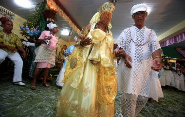 simoes filho, bahia, barazil - february 27, 2016: integrants of the Candomble religion are seen during a religious celebration in a terreiro in the city of Simoes Filho.
