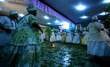 simoes filho, bahia, barazil - february 27, 2016: integrants of the Candomble religion are seen during a religious celebration in a terreiro in the city of Simoes Filho.