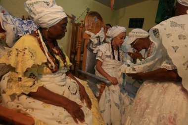 simoes filho, bahia, barazil - february 27, 2016: integrants of the Candomble religion are seen during a religious celebration in a terreiro in the city of Simoes Filho.