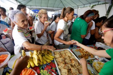 salvador, bahia, brazil - october 13, 2019: food distribution during social action in the city of Salvador. clipart