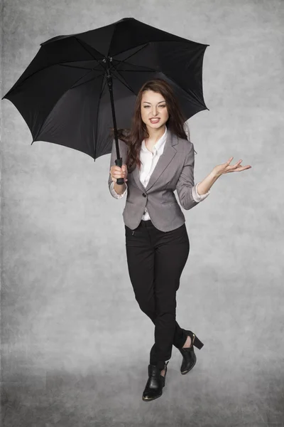 Business woman under an umbrella — Stock Fotó