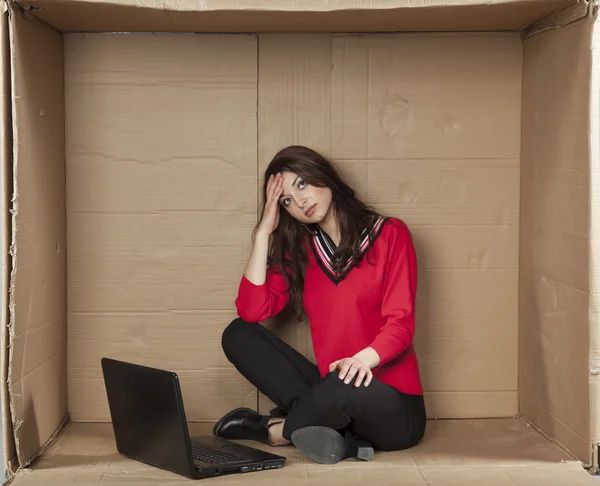 Depressed business woman sitting in the office — Stockfoto