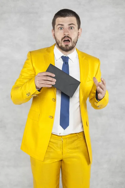 Surprised businessman with a bribe in hand — Stock Photo, Image
