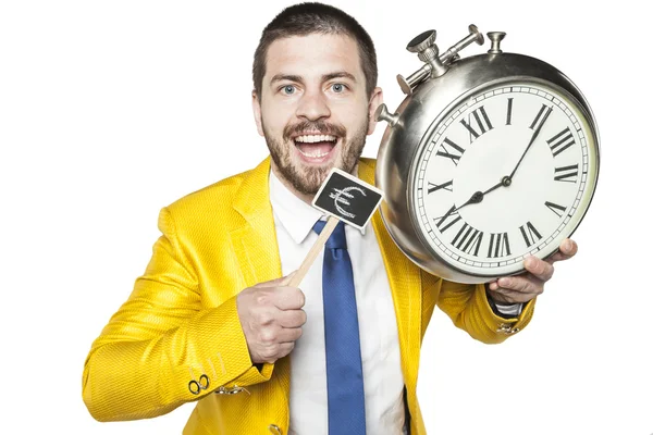Empresário segurando um relógio e símbolo de moeda — Fotografia de Stock