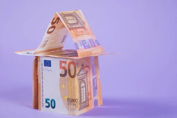 real estate investment, a house made of euro currency