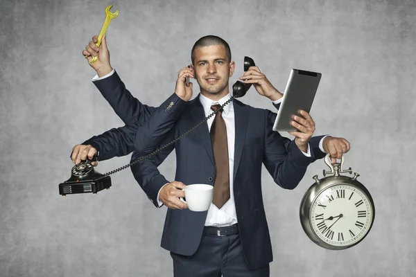 Multipurpose businessman — Stock Photo, Image