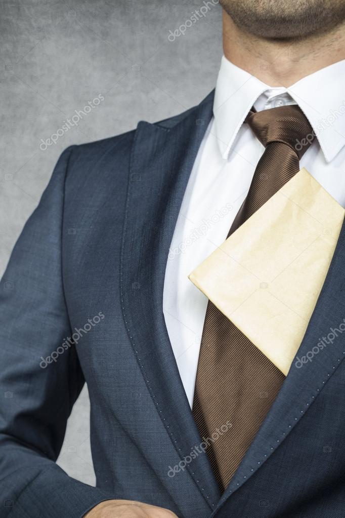 Proud businessman with envelope