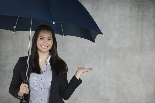 A woman under an umbrella — Stock Photo, Image