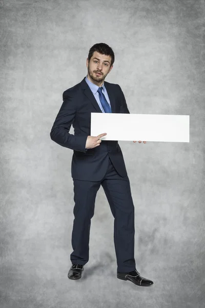 Businessman pointing place advertisement — Stock Photo, Image