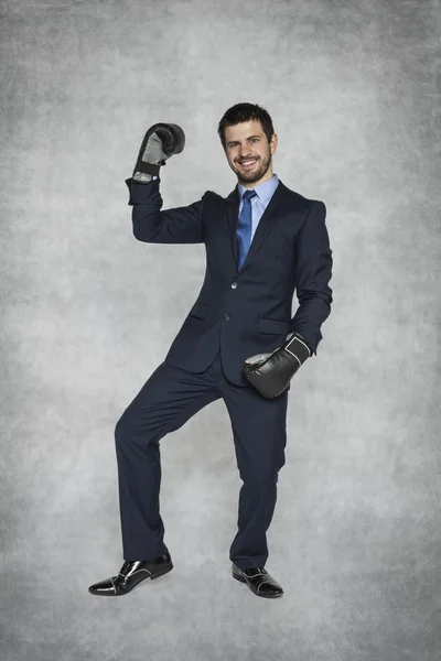 Businessman showing his muscles — Stock Photo, Image