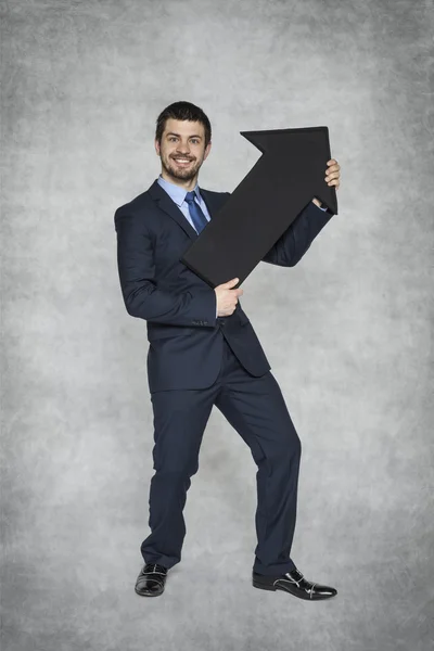 Geschäftsmann zeigt Wachstum — Stockfoto