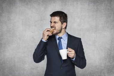 businessman biting a sandwich clipart