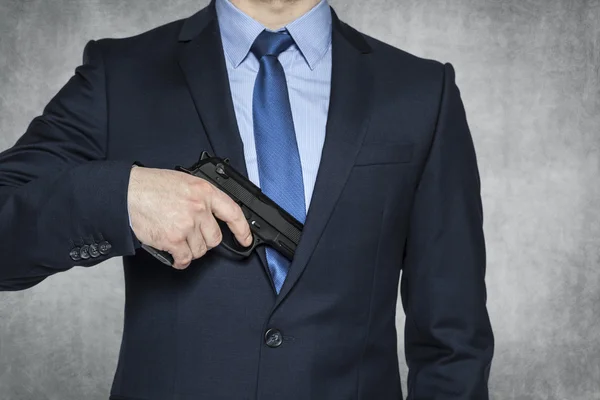 Businessman with a gun — Stock Photo, Image