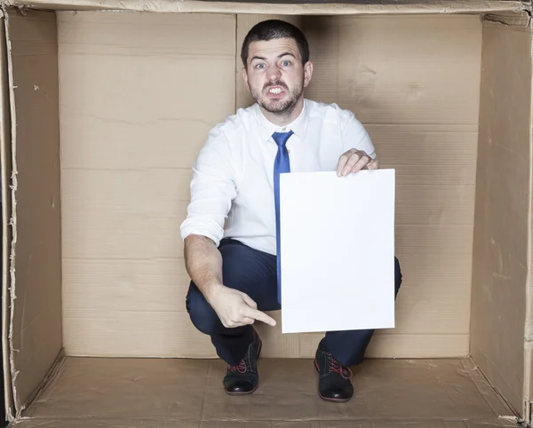 Angry businessman pointing paper — Stock Photo, Image